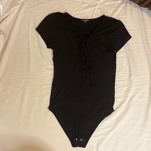 Black short sleeve body suit with deep V neck